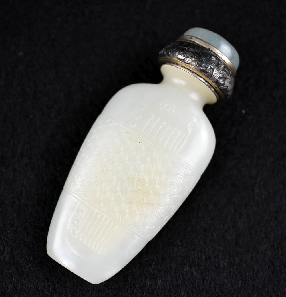 Appraisal: FINE CHIN SILVER MOUNTED WHITE JADE SNUFF BOTTLEThe transparent evenly