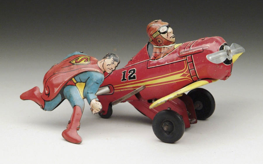 Appraisal: SUPERMAN ROLLOVER PLANE When plane is wound Superman seemingly turns