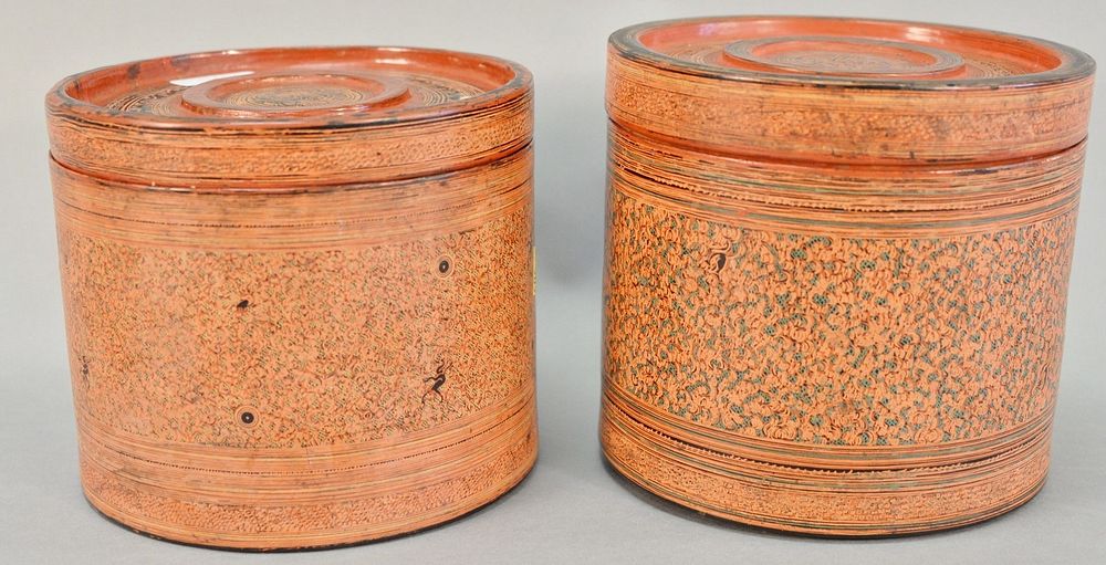 Appraisal: Pair of Burmese circular lidded boxes with inserts decorated with