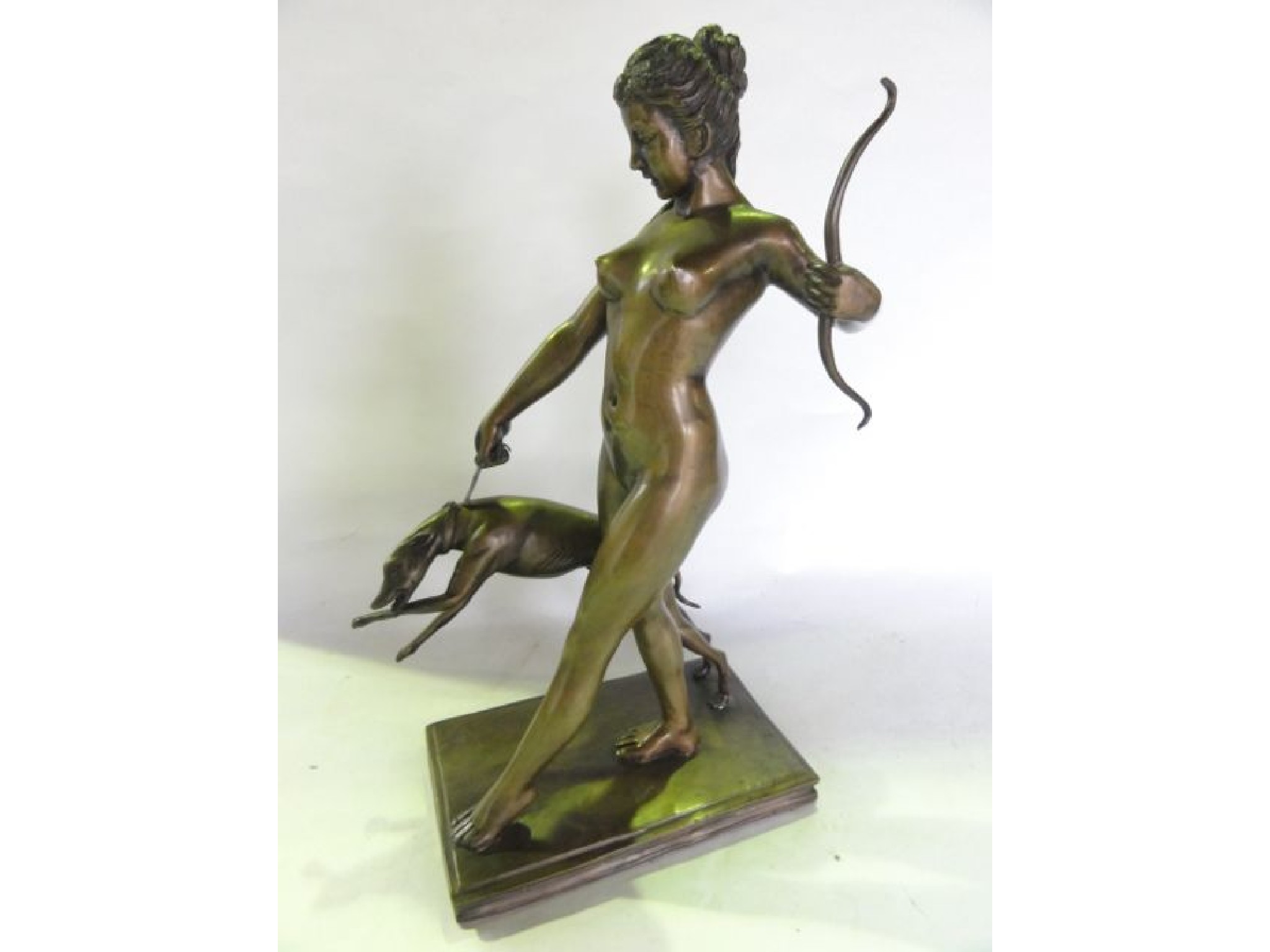 Appraisal: A cast bronze study of Diana the Huntress presented nude