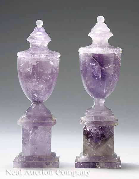 Appraisal: A Pair of Classical-Style Amethyst Urns on molded plinth bases