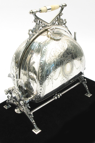 Appraisal: AN ENGLISH VICTORIAN SILVER PLATED BUN WARMER having engraved sides