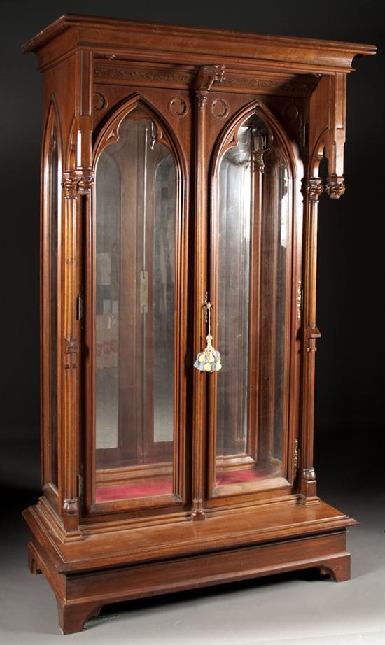 Appraisal: English gothic revival walnut beveled glass panel two-door cabinet fourth