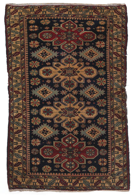 Appraisal: Caucasian rug c stylized floral design in muted tones with