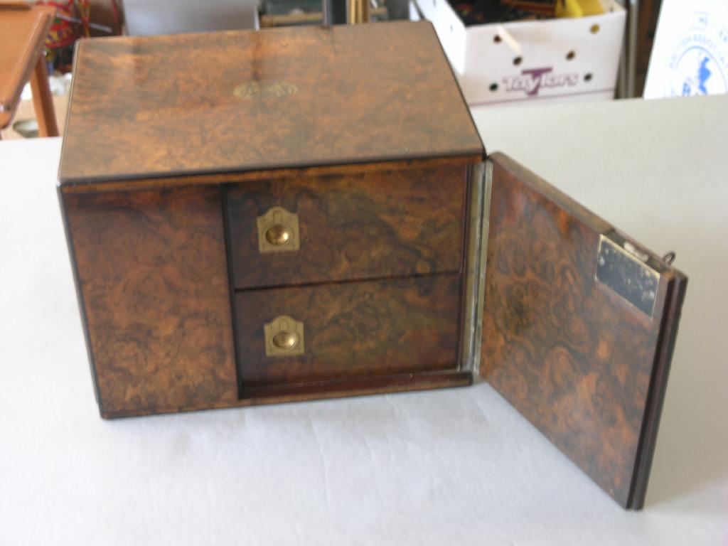 Appraisal: A mid Victorian burr walnut veneered table-top cabinet pair of