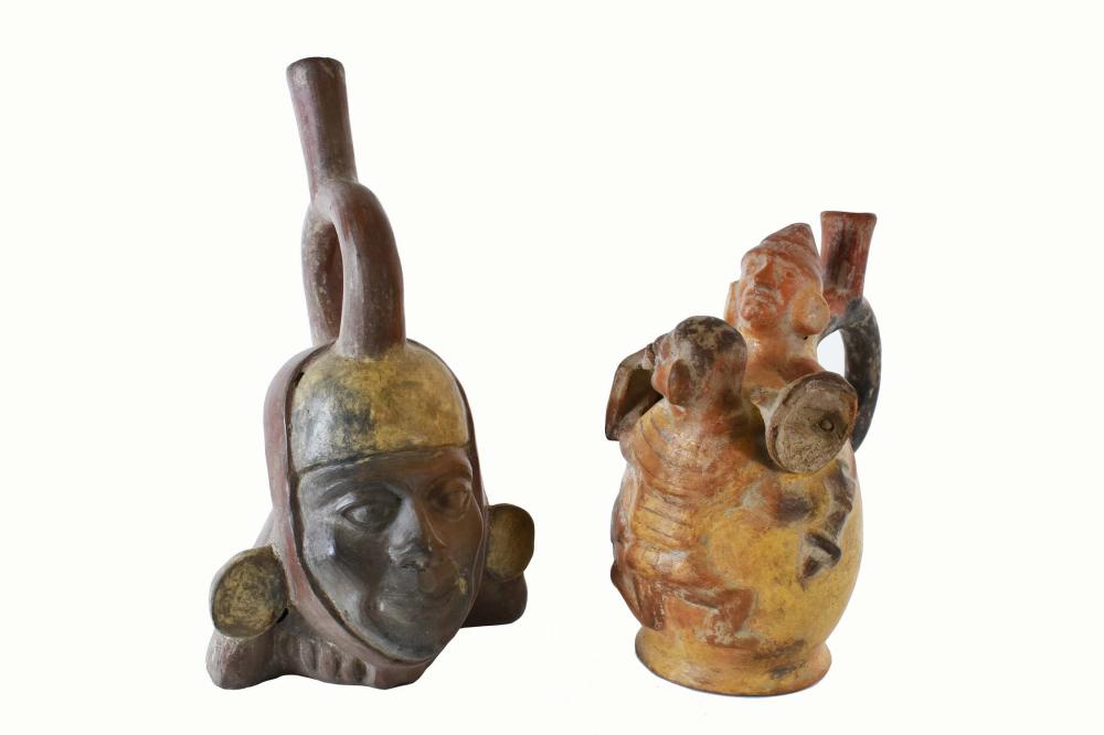 Appraisal: TWO PRE-COLUMBIAN STYLE POTTERY STIRRUP VESSELSPeruvian Moche Portrait Stirrup bottle