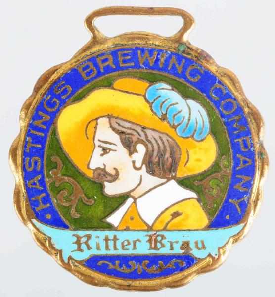 Appraisal: Hastings Brewing Company Enameled Portrait Fob Wonderful colors and graphics