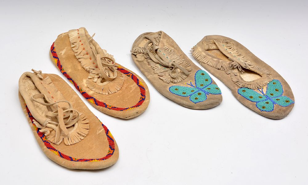 Appraisal: Native American moccasins with beadwork two pair Native American moccasins