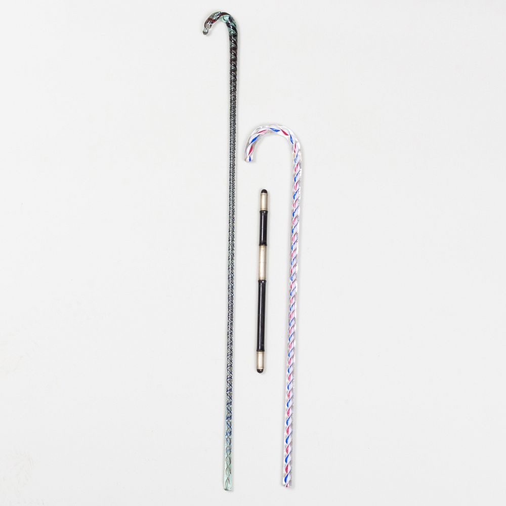 Appraisal: Two Internally Decorated Glass Canes and a English Metal-Mounted Ebony