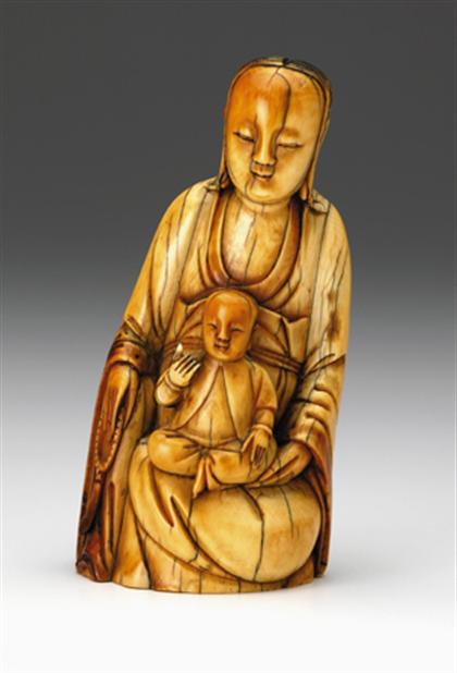 Appraisal: Chinese elephant ivory carving of Quanyin and child ming dynasty