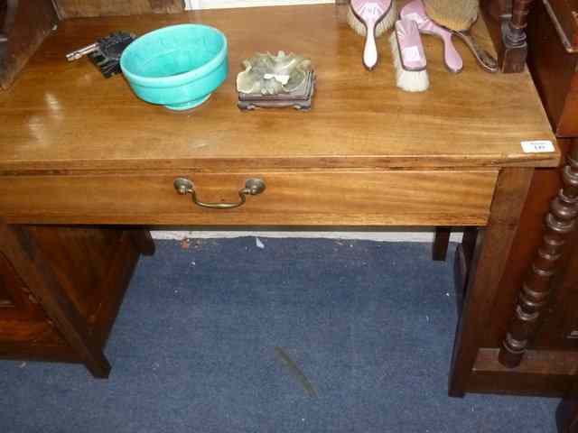 Appraisal: A MAHOGANY SIDE TABLE with single drawer standing on square