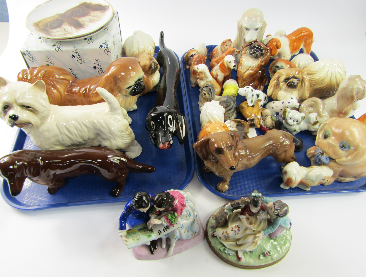 Appraisal: A collection of ceramic model dogs including Royal Doulton Bulldog