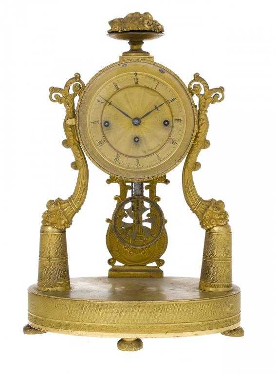 Appraisal: A BIEDERMEIER GILT BRASS CLOCK the milled drum-cased movement with