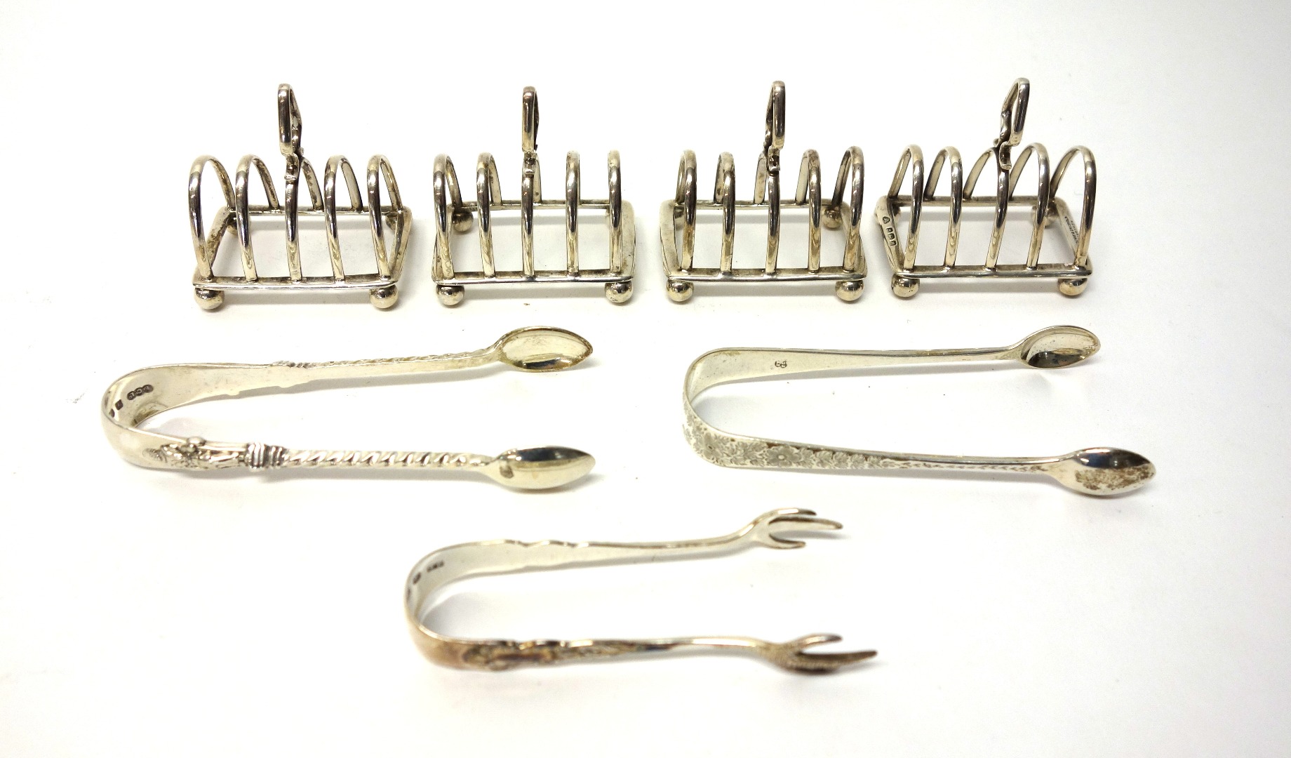 Appraisal: Three and one further silver miniature five bar toastracks each