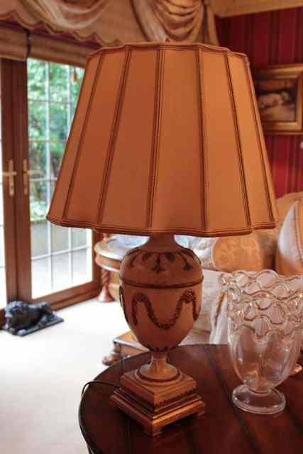 Appraisal: A CREAM PAINTED AND PARCEL GILT TABLE LAMP in the