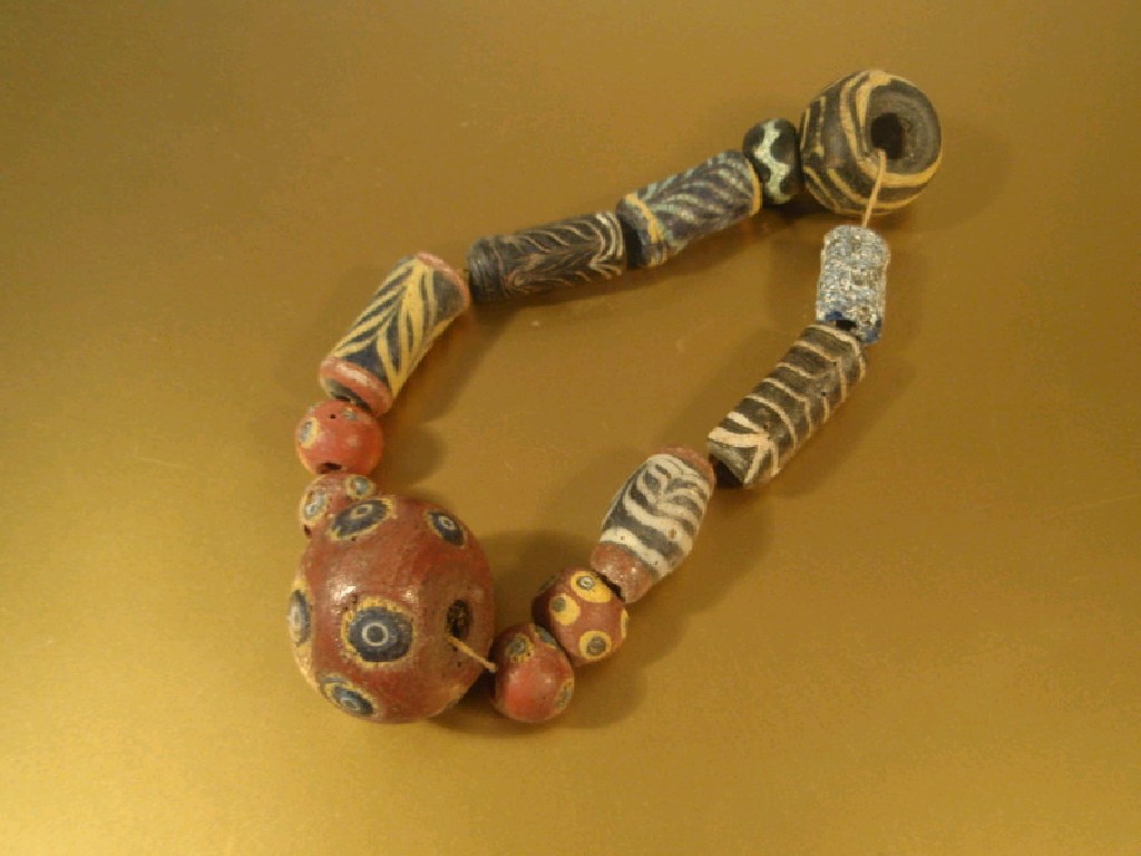 Appraisal: An assorted collection of Roman and Byzantine polychrome glass beads