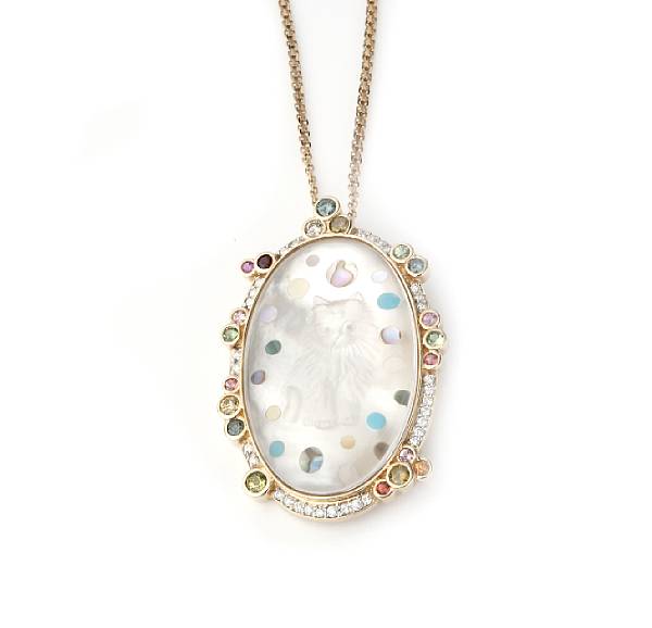 Appraisal: A carved mother-of-pearl multi-colored diamond and sapphire pendant pendant converts