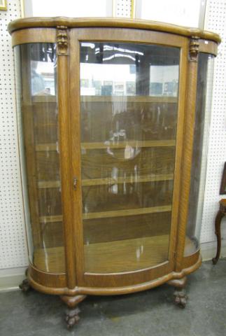 Appraisal: Antique Oak Curved Glass China Cabinet with paw feet and