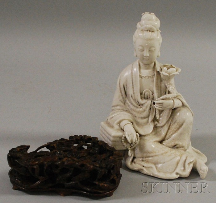 Appraisal: Blanc-de-Chine Guanyin Figure China seated figure of Guanyin holding a