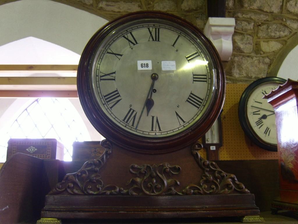 Appraisal: A Regency mahogany dial clock enclosing a silvered dial and