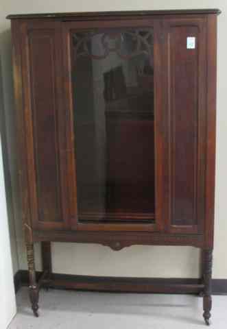 Appraisal: WALNUT CHINA CABINET American c 's the front centering a