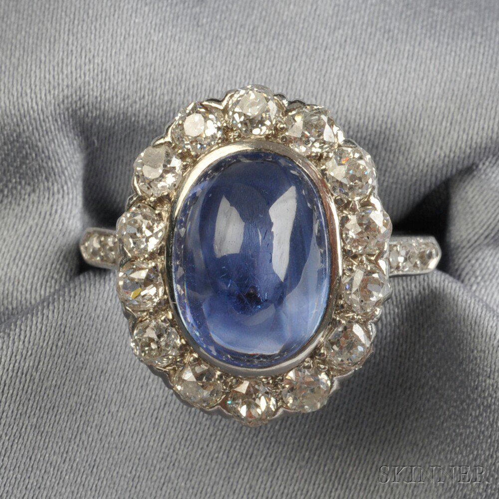 Appraisal: Platinum Sapphire and Diamond Ring set with a cabochon sapphire