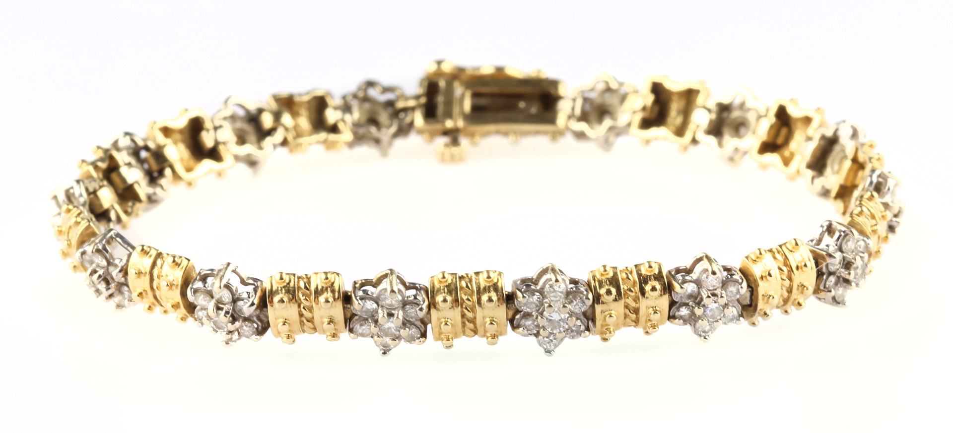 Appraisal: A Bracelet with Diamond Flower Motif K white and yellow