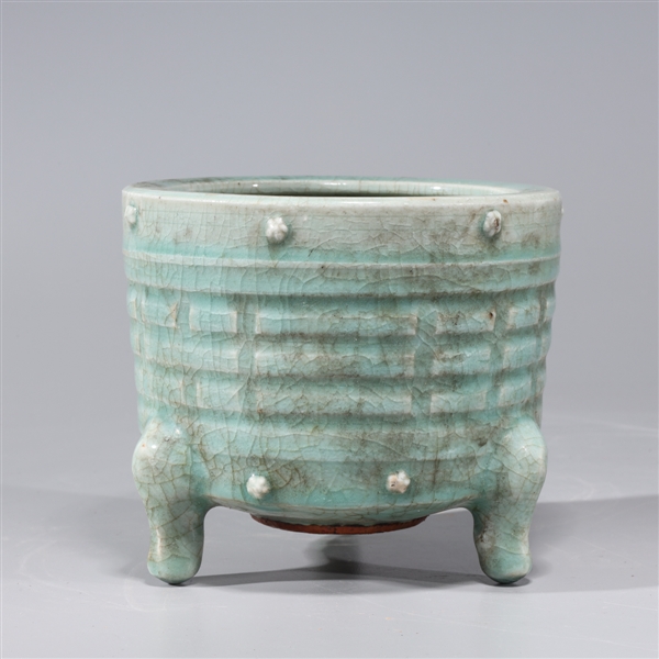 Appraisal: Chinese crackle glazed celadon tripod censer with molded designs to