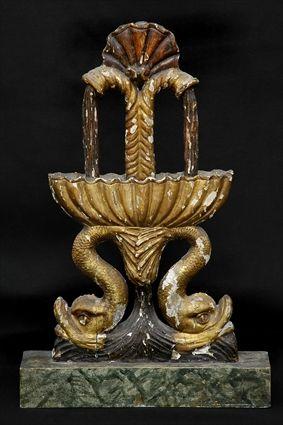 Appraisal: ITALIAN CARVED PAINTED AND PARCEL-GILT TABLE DECORATION AND A CREST