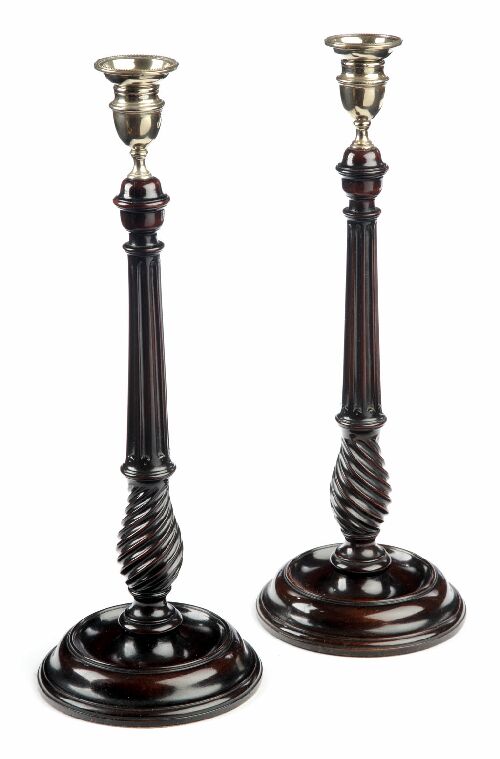 Appraisal: A pair of George III mahogany and brass candlesticks each