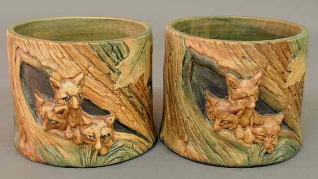 Appraisal: Pair of Weller pottery jardini res with relief scenes of