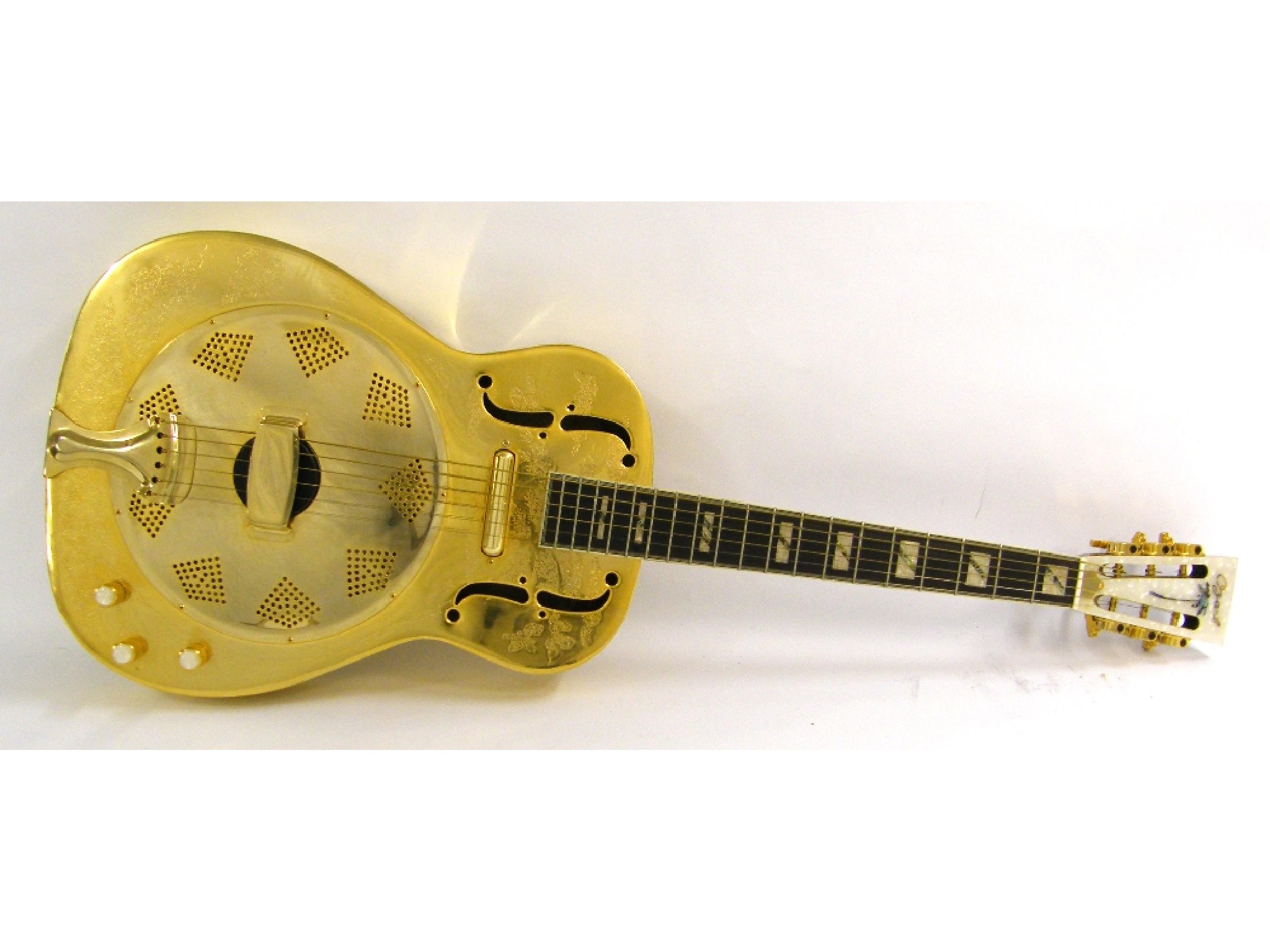 Appraisal: Ozark electric resonator guitar with brass machine engraved body electrics