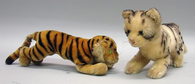 Appraisal: Pair of mohair animals L Gold mohair tiger Green glass