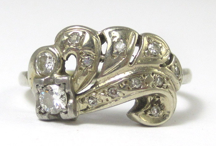 Appraisal: DIAMOND AND FOURTEEN KARAT WHITE GOLD RING set with twelve