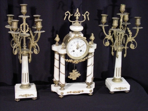 Appraisal: LOUIS XVI STYLE WHITE MARBLE CLOCK GARNITURE The gilt metal