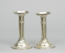 Appraisal: A Pair Of Sterling Silver Candlesticks A pair of simple