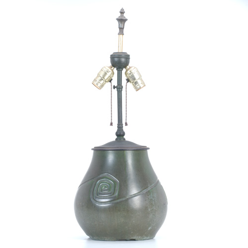 Appraisal: HAMPSHIRE Bulbous matte green factory lamp base with swirled pattern