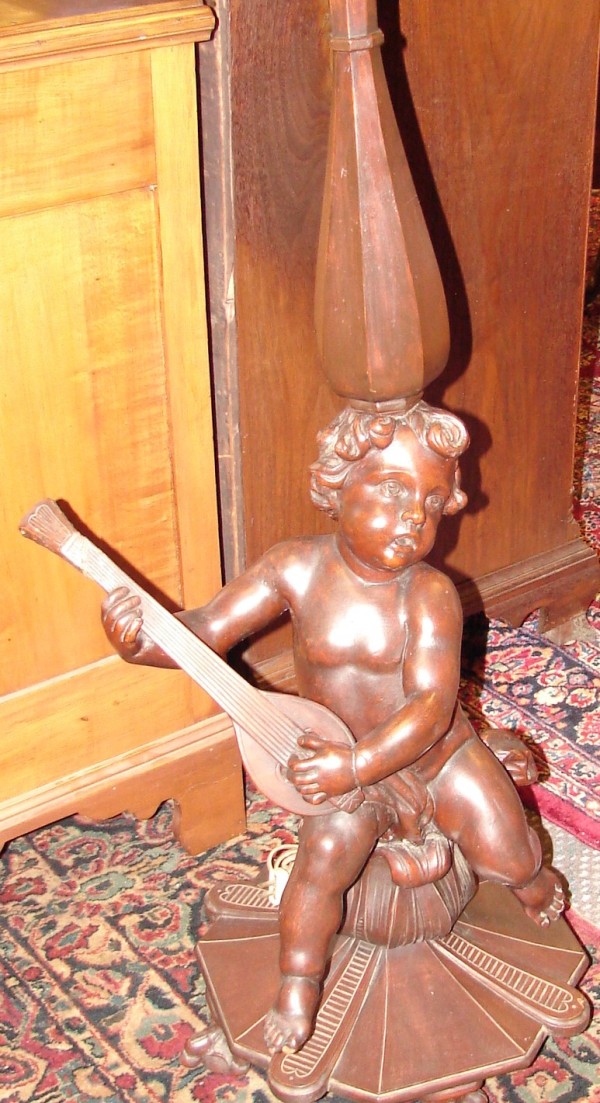 Appraisal: Wood carved lamp features putti figure playing mandolin t electrified