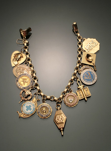 Appraisal: -Karat Yellow-Gold Charm Bracelet Suspending seven -karat yellow-gold four tested