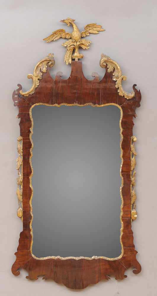 Appraisal: GEORGE II WALNUT AND PARCEL GILT MIRROR The plate within