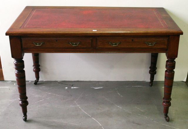 Appraisal: An Edwardian style oak desk Circa s with tooled leather