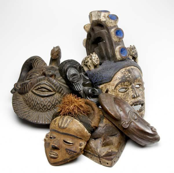 Appraisal: SIX CARVED WOODEN AFRICAN MASKS Large mask flanked by two