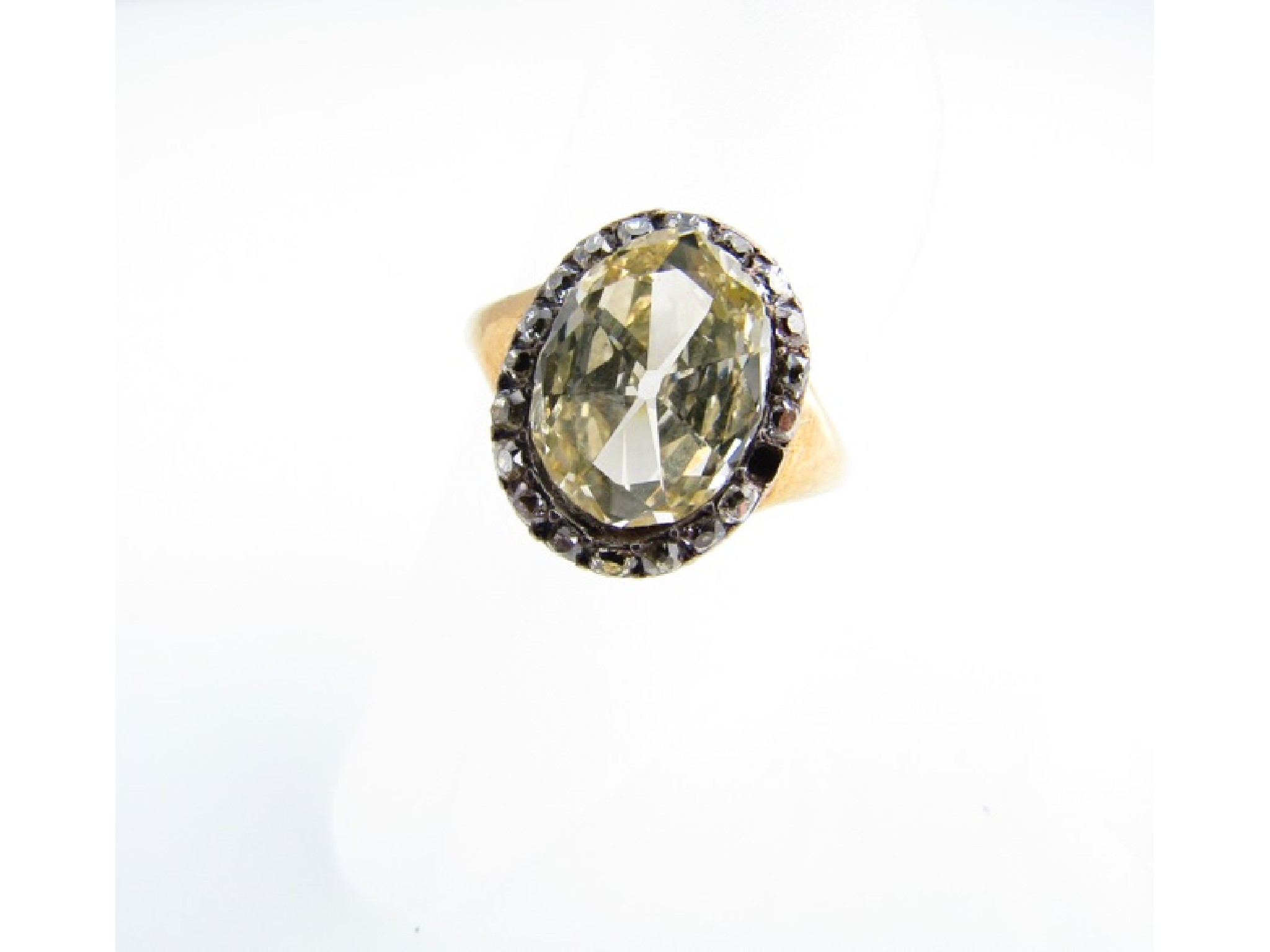 Appraisal: A Victorian diamond ring centred with an oval old-cut diamond