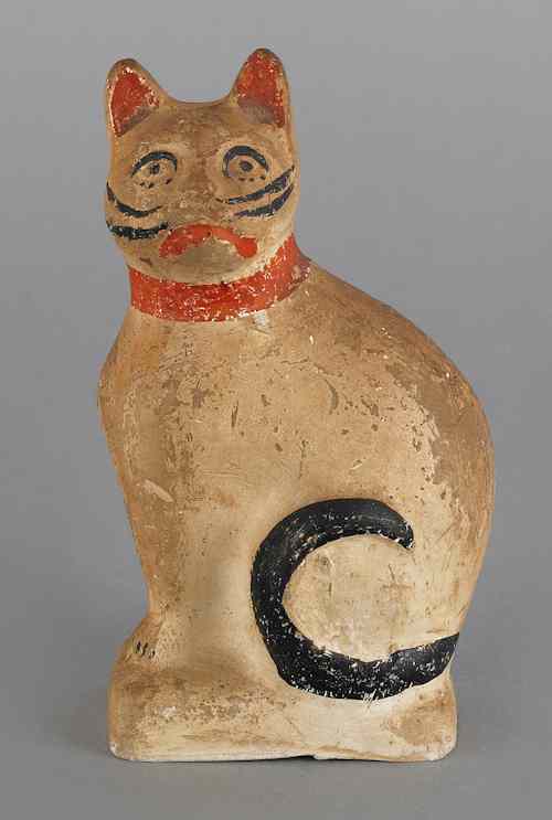 Appraisal: Small chalkware cat th c with red and black polychrome