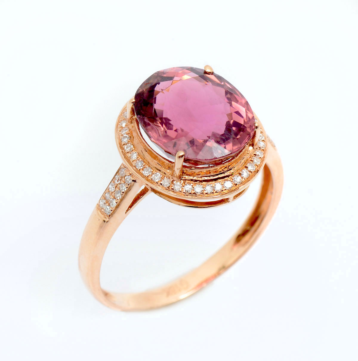 Appraisal: K TOURMALINE DIAMOND RING K yellow gold ring contains one