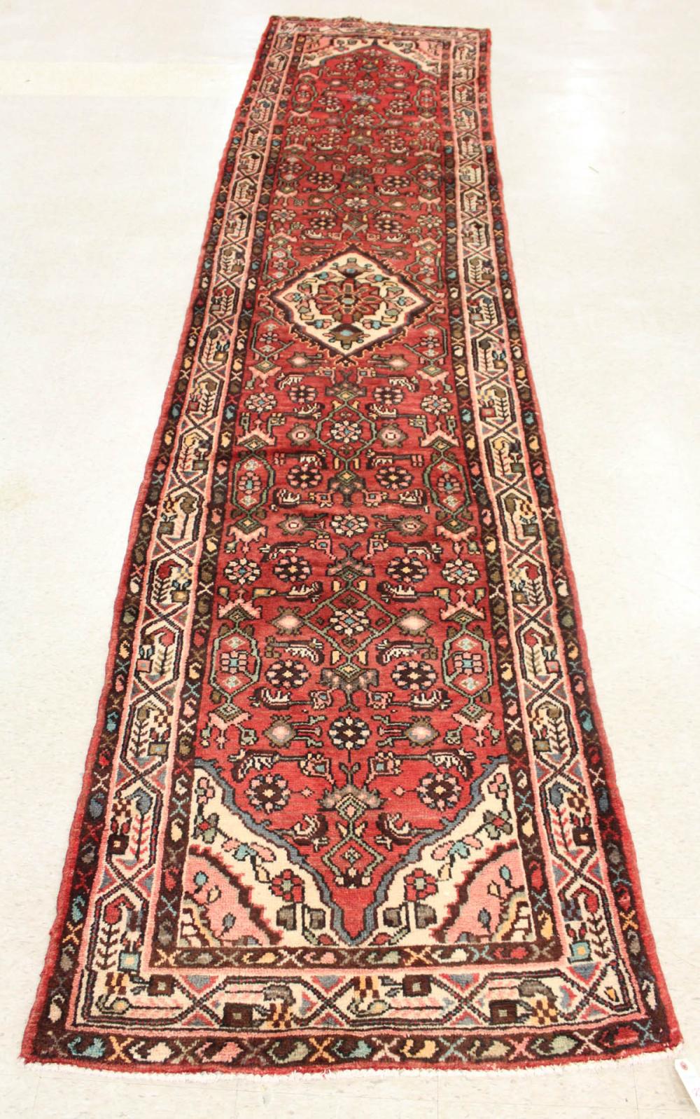 Appraisal: PERSIAN HAMADAN RUNNER northwestern Iran floral design on red ground