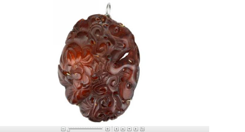 Appraisal: Chinese carved amber pendant early th century silver mounts later