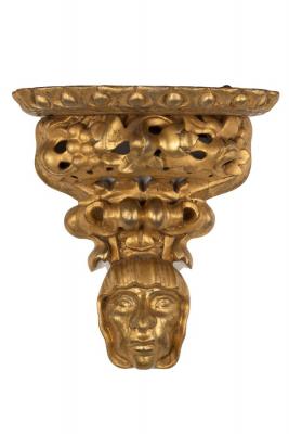 Appraisal: A Florentine gilt wall bracket the shelf above pierced foliate