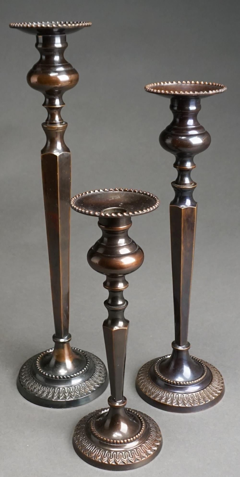 Appraisal: Set of Three Indian Patinated Bronze Candlesticks H of tallest