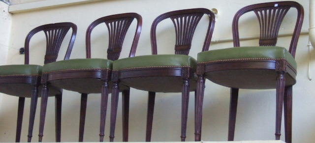 Appraisal: A set of eighteen French mahogany framed dining chairs with